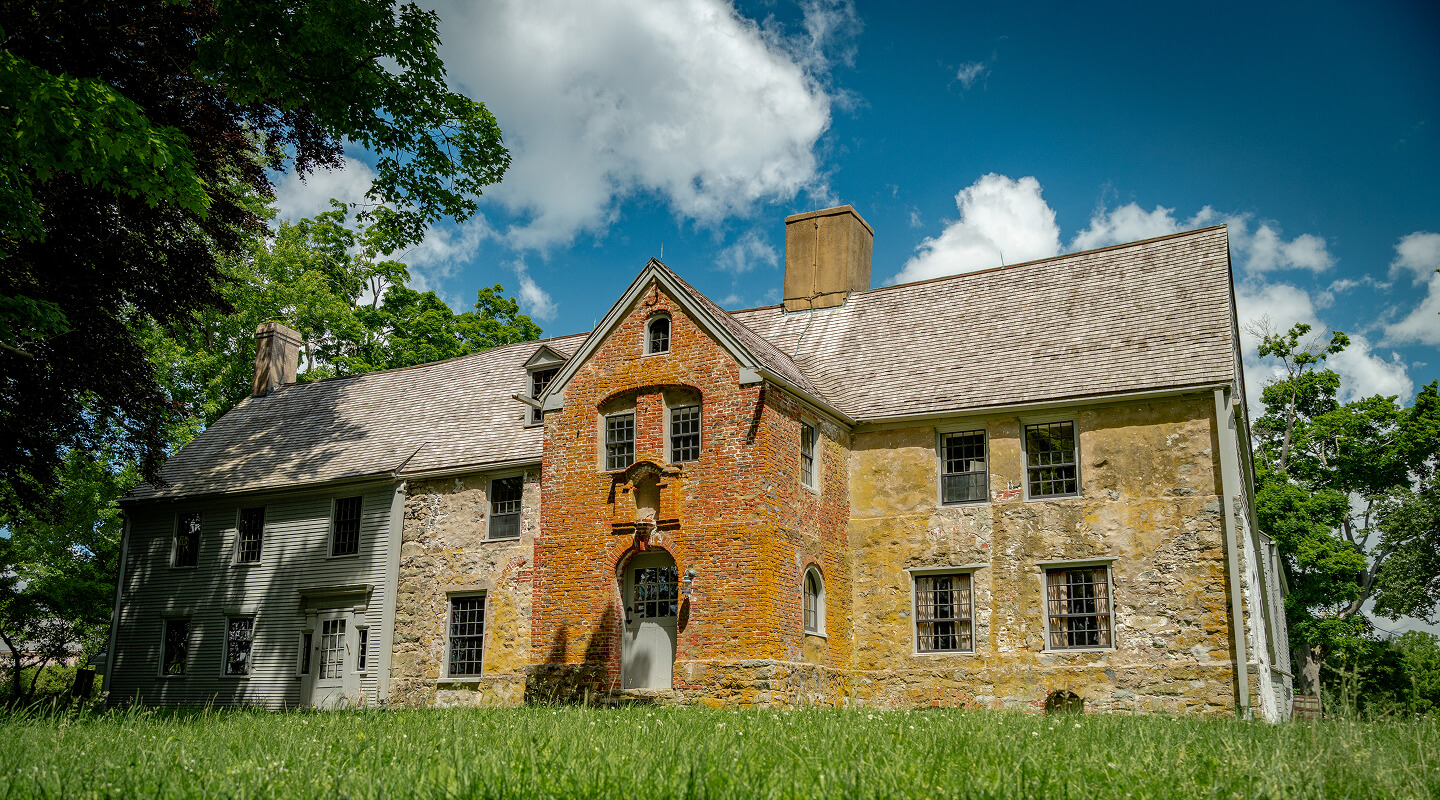 A photo of the exterior of Spencer-Peirce-Little Farm.