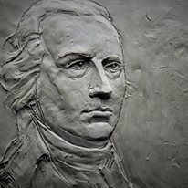 A relief of the profile of a man.